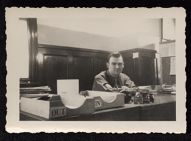 James L. White at desk